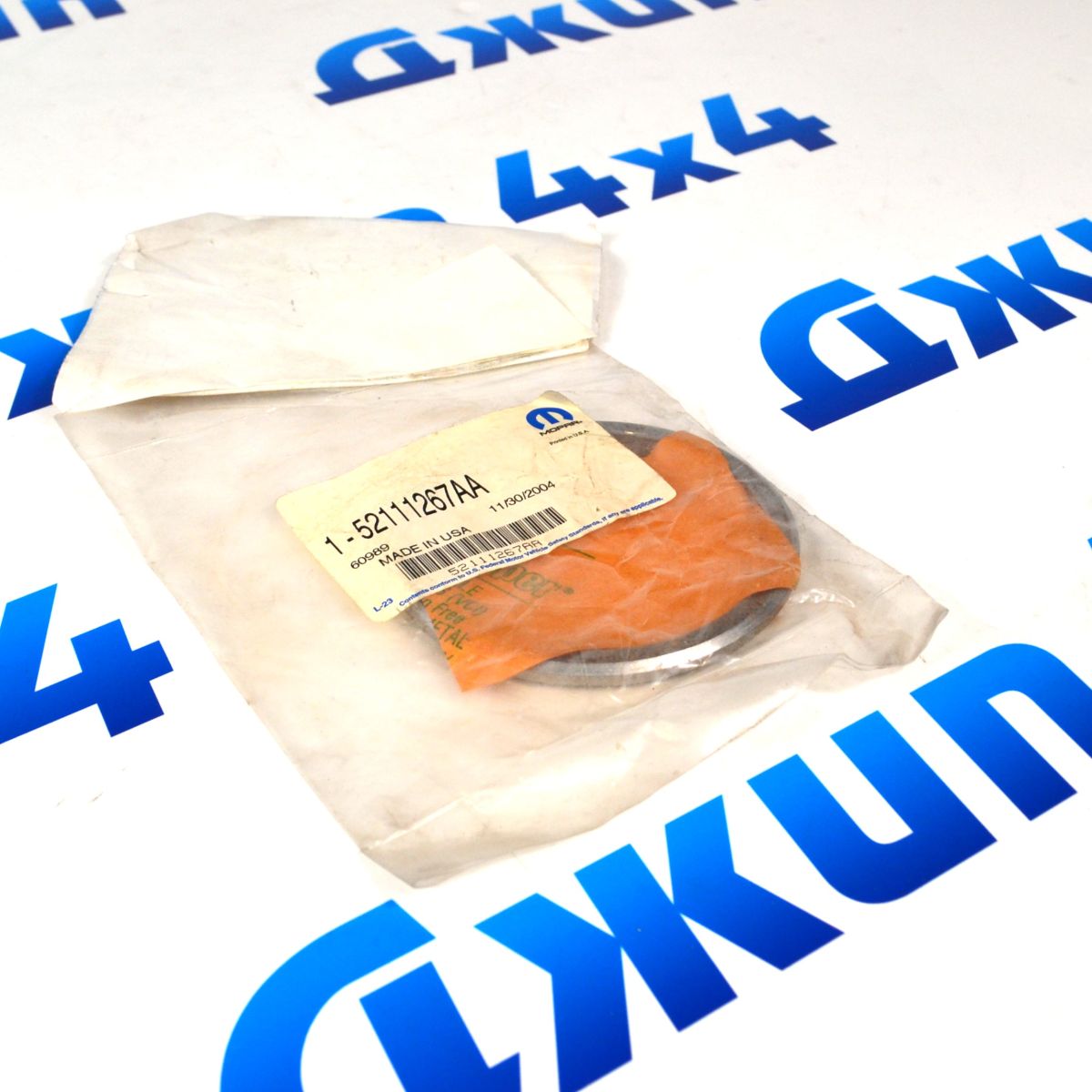 Шайба регулировочная хвостовика переднего дифференциала Jeep Grand Cherokee 52111267AA