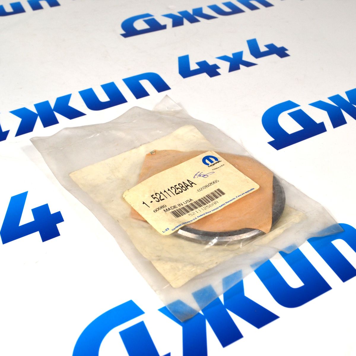 Шайба регулировочная хвостовика переднего дифференциала Jeep Grand Cherokee 52111258AA